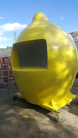 Bright yellow lemon shaped lemonade stand painted with Safety Yellow polyester gel coat.